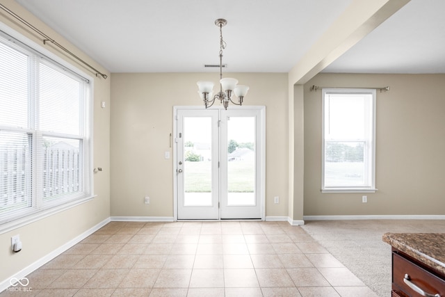 3827 Dusty Sands Rd, Whitestown, IN 46075 - doorway to outside with a chandelier, healthy amount of natural light, and light tile patterned flooring