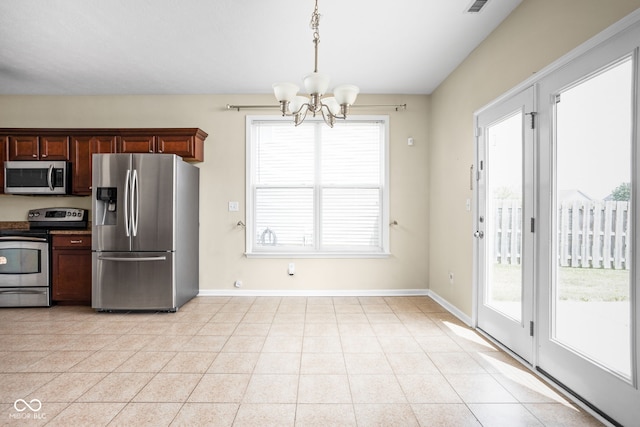 3827 Dusty Sands Rd, Whitestown, IN 46075 - kitchen featuring appliances with stainless steel finishes, a chandelier, and pendant lighting