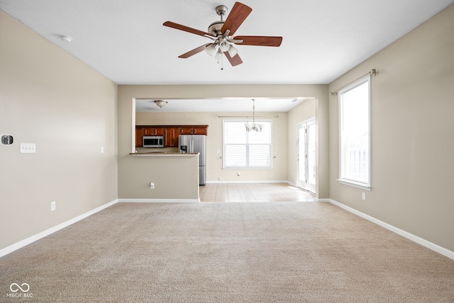 3827 Dusty Sands Rd, Whitestown, IN 46075 - unfurnished living room with a ceiling fan and light carpet