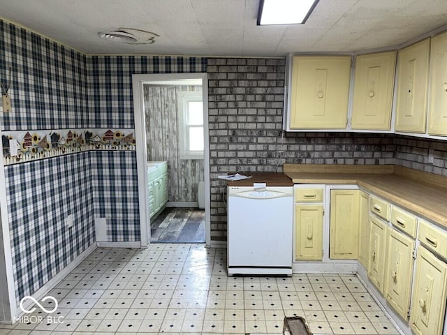 3074 N 625 E, Franklin, IN 46131 - kitchen with wallpapered walls, light floors, light countertops, cream cabinets, and white dishwasher