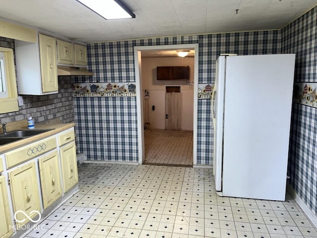 3074 N 625 E, Franklin, IN 46131 - kitchen with wallpapered walls, freestanding refrigerator, light countertops, and light floors
