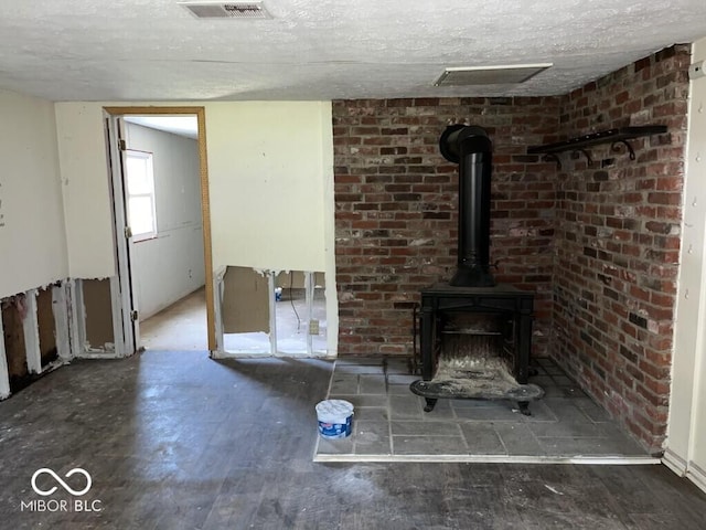 3074 N 625 E, Franklin, IN 46131 - unfurnished living room featuring a wood stove and a textured ceiling
