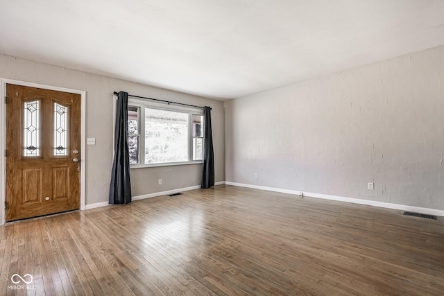 1701 N Gladstone Ave, Indianapolis, IN 46218 - foyer entrance with hardwood / wood-style flooring and plenty of natural light