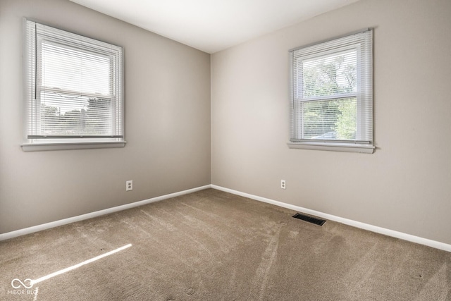 1701 N Gladstone Ave, Indianapolis, IN 46218 - unfurnished room featuring carpet floors and baseboards