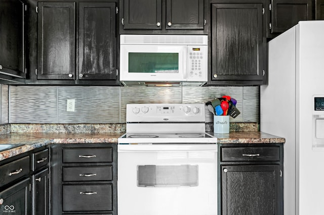 49 Grassy Dr, Whiteland, IN 46184 - kitchen featuring white appliances, dark cabinetry, and tasteful backsplash