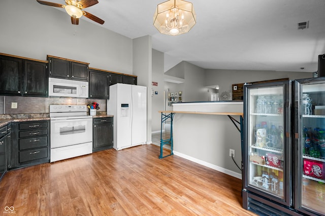 49 Grassy Dr, Whiteland, IN 46184 - kitchen featuring white appliances, lofted ceiling, decorative backsplash, ceiling fan, and light wood finished floors