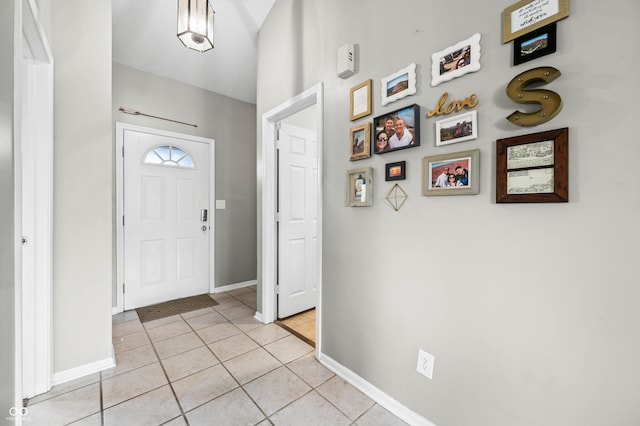 49 Grassy Dr, Whiteland, IN 46184 - foyer entrance with light tile patterned flooring and baseboards