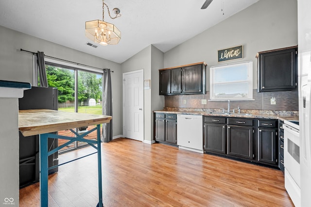 49 Grassy Dr, Whiteland, IN 46184 - kitchen featuring white appliances, vaulted ceiling, tasteful backsplash, light wood-style flooring, and a chandelier