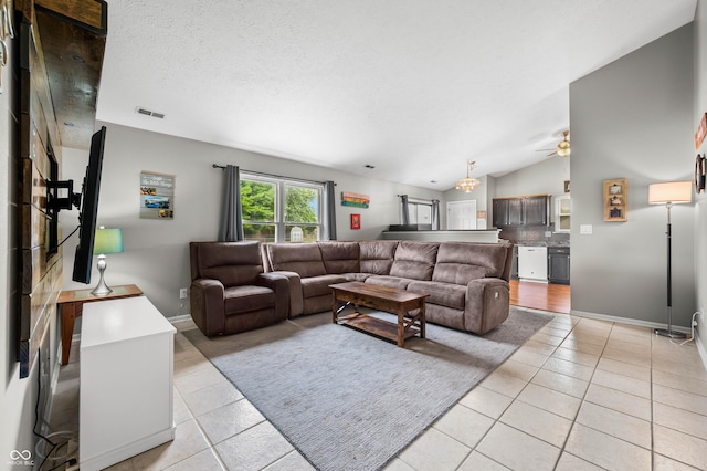 49 Grassy Dr, Whiteland, IN 46184 - living area with light tile patterned flooring, vaulted ceiling, and a ceiling fan