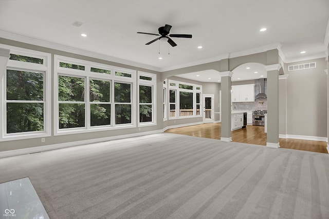 7131 Nile Ridge Ct, Indianapolis, IN 46236 - unfurnished living room featuring decorative columns, ceiling fan, crown molding, recessed lighting, and light wood-style flooring