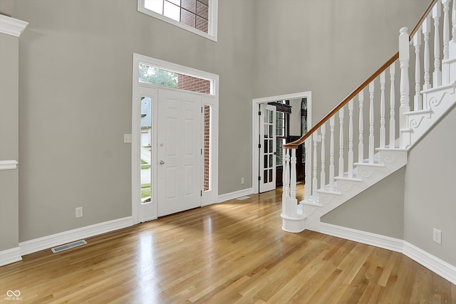 7131 Nile Ridge Ct, Indianapolis, IN 46236 - foyer entrance featuring healthy amount of natural light, wood finished floors, a high ceiling, and stairway