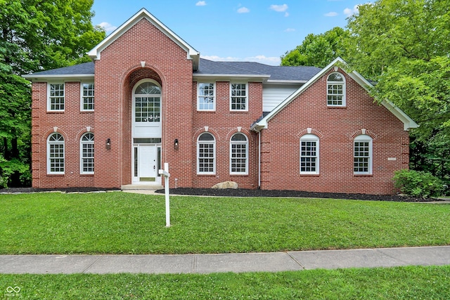 7131 Nile Ridge Ct, Indianapolis, IN 46236 - view of front of property featuring brick siding, a front lawn, and a shingled roof