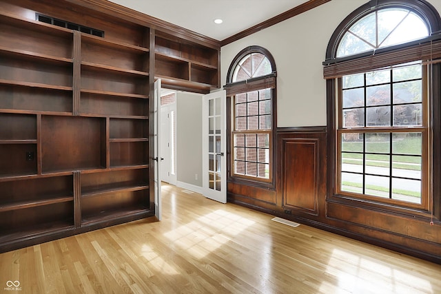 7131 Nile Ridge Ct, Indianapolis, IN 46236 - entrance foyer featuring crown molding, light wood finished floors, healthy amount of natural light, and french doors