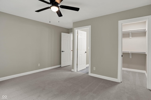 7131 Nile Ridge Ct, Indianapolis, IN 46236 - unfurnished bedroom featuring carpet, a walk in closet, ceiling fan, and a closet