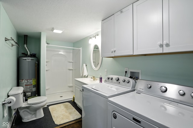 8453 S Christian Dr, Princes Lakes, IN 46164 - washroom featuring water heater, washing machine and clothes dryer, and a textured ceiling