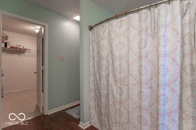 8703 Mellot Way, Camby, IN 46113 - bathroom with a textured ceiling, wood finished floors, and a shower with shower curtain