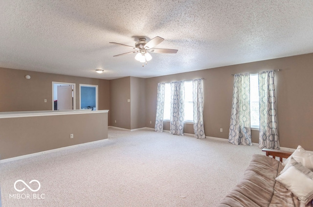 8703 Mellot Way, Camby, IN 46113 - living room with ceiling fan, light carpet, and a textured ceiling