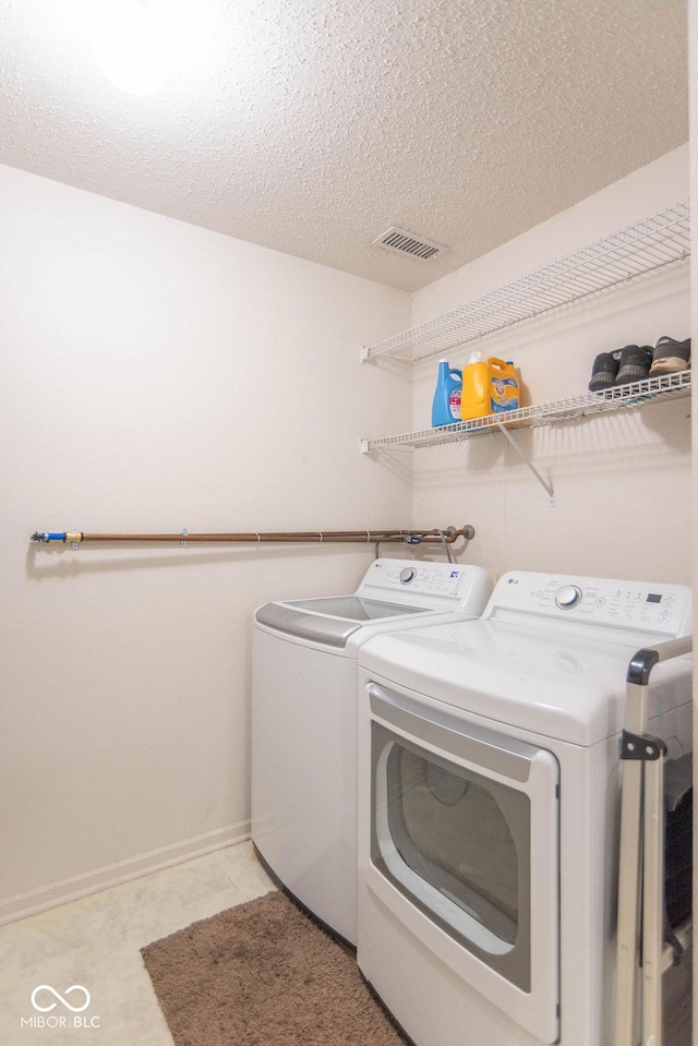 8703 Mellot Way, Camby, IN 46113 - laundry room with independent washer and dryer and a textured ceiling