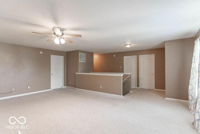 8703 Mellot Way, Camby, IN 46113 - unfurnished room featuring light colored carpet, ceiling fan, and a textured ceiling