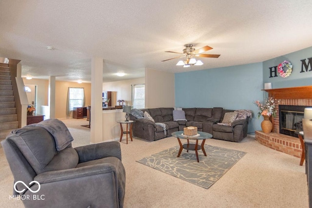8703 Mellot Way, Camby, IN 46113 - carpeted living room featuring stairway, a textured ceiling, a fireplace, and ceiling fan