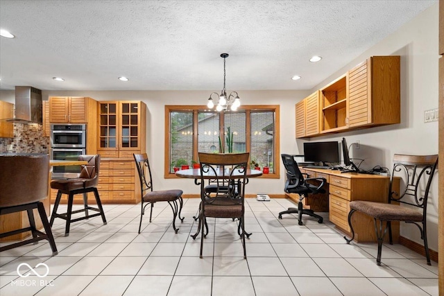 5298 Royal Troon Way, Avon, IN 46123 - dining area featuring recessed lighting, a chandelier, a textured ceiling, and built in desk