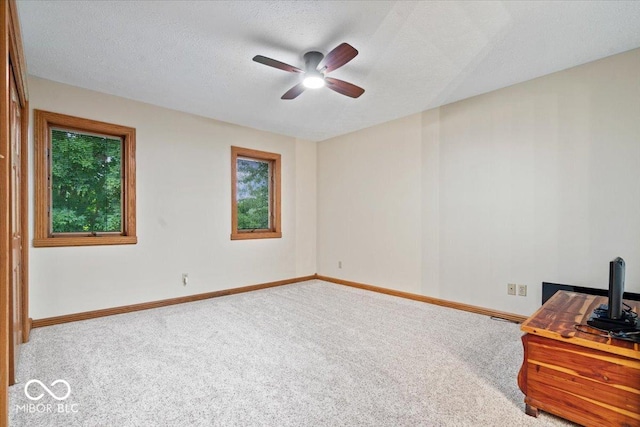 5298 Royal Troon Way, Avon, IN 46123 - unfurnished room featuring carpet, ceiling fan, and a textured ceiling
