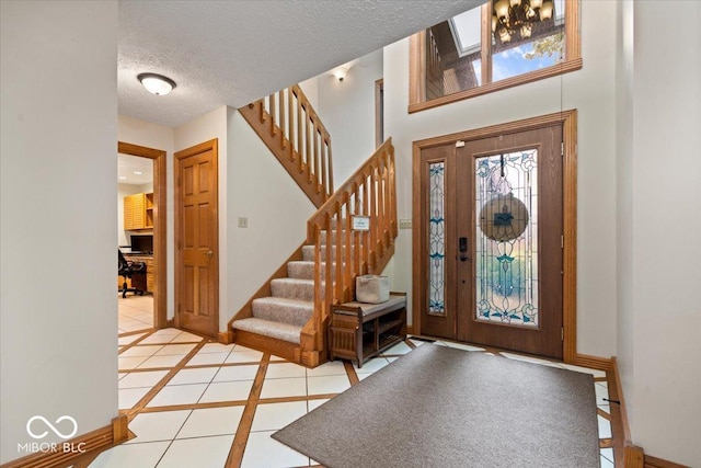5298 Royal Troon Way, Avon, IN 46123 - tiled entrance foyer featuring stairs and a textured ceiling