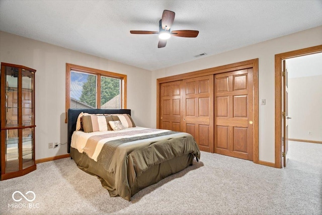 5298 Royal Troon Way, Avon, IN 46123 - carpeted bedroom featuring a closet, ceiling fan, and a textured ceiling