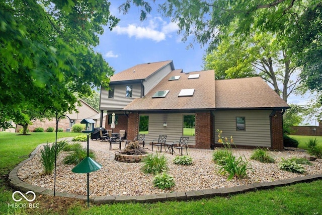 5298 Royal Troon Way, Avon, IN 46123 - rear view of property featuring a patio area, a lawn, and brick siding