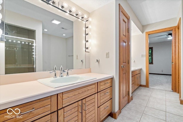 5298 Royal Troon Way, Avon, IN 46123 - bathroom featuring vanity, tile patterned flooring, and a stall shower