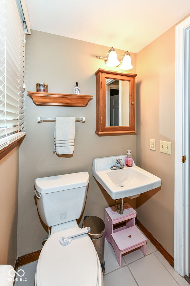 7014 Creekside Ln, Indianapolis, IN 46220 - bathroom featuring toilet and tile patterned floors