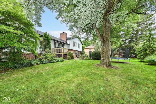 7014 Creekside Ln, Indianapolis, IN 46220 - view of green lawn featuring a trampoline