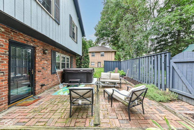 7014 Creekside Ln, Indianapolis, IN 46220 - fenced backyard with a hot tub, a patio area, an outdoor hangout area, and a gate
