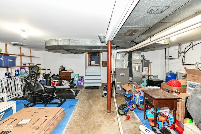 7014 Creekside Ln, Indianapolis, IN 46220 - unfinished basement featuring a water pressure tank and heating unit