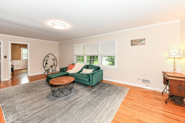 7014 Creekside Ln, Indianapolis, IN 46220 - living room featuring light wood-style flooring and crown molding