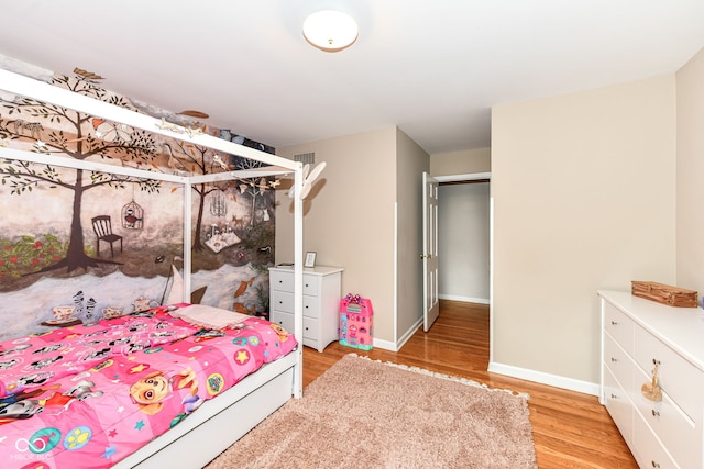7014 Creekside Ln, Indianapolis, IN 46220 - bedroom with light wood-type flooring and baseboards