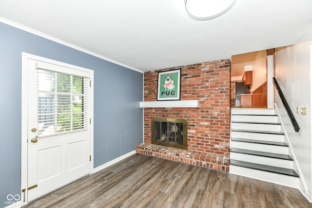 7014 Creekside Ln, Indianapolis, IN 46220 - unfurnished living room with wood finished floors, stairway, crown molding, and a fireplace