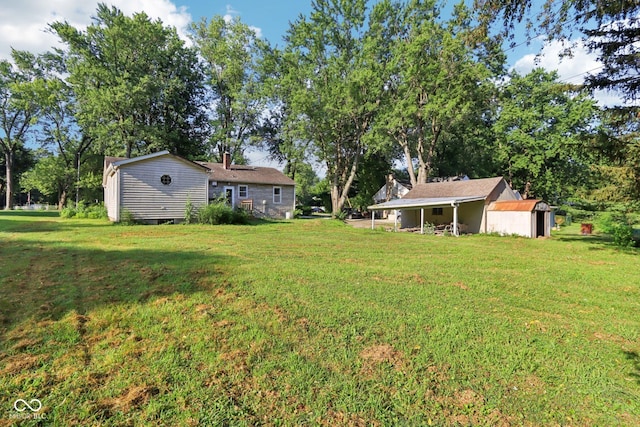 202 W Elbert St, Indianapolis, IN 46217 - view of grassy yard with an outdoor structure