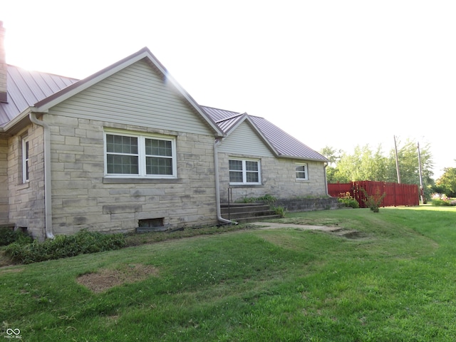 219 S Main St, Modoc, IN 47358 - rear view of house featuring stone siding, a metal roof, and a standing seam roof