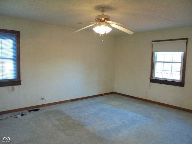219 S Main St, Modoc, IN 47358 - empty room featuring a ceiling fan and light carpet