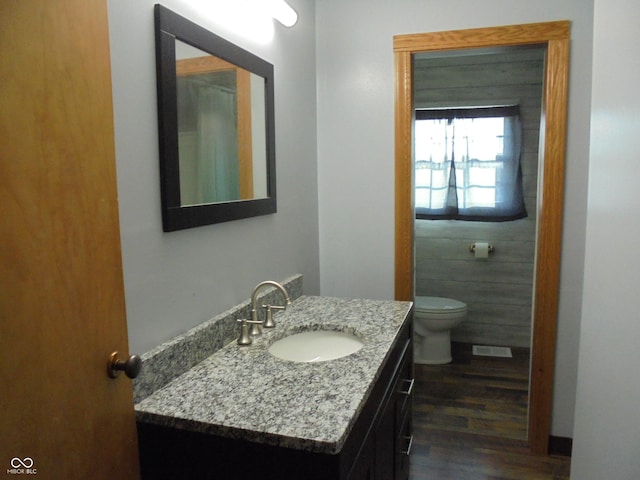219 S Main St, Modoc, IN 47358 - half bath with vanity and wood finished floors