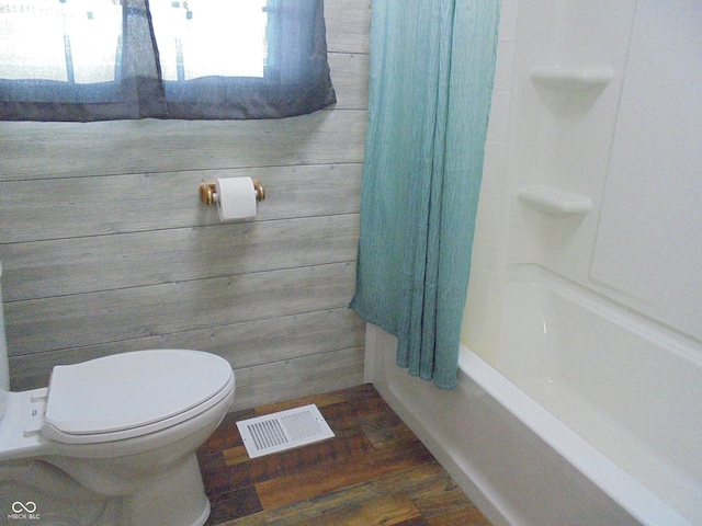 219 S Main St, Modoc, IN 47358 - bathroom with wood finished floors and shower / bath combination