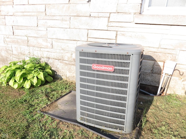 219 S Main St, Modoc, IN 47358 - exterior view of a central AC unit and stone siding