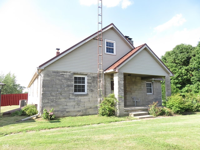 219 S Main St, Modoc, IN 47358 - rear view of house with a chimney and stone siding