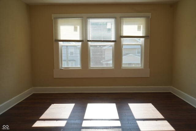 3554 N Illinois St, Indianapolis, IN 46208 - empty room featuring dark wood-style flooring and baseboards