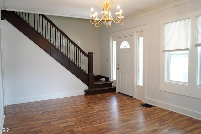 3554 N Illinois St, Indianapolis, IN 46208 - entryway featuring wood finished floors, stairs, ornamental molding, and a chandelier