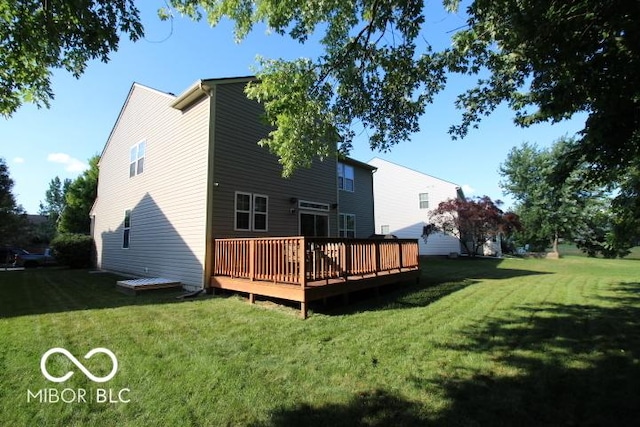 11275 Catalina Dr, Fishers, IN 46038 - back of house featuring a wooden deck and a lawn