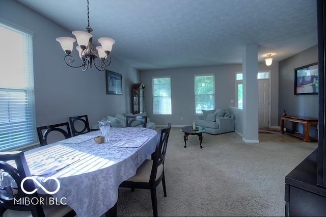11275 Catalina Dr, Fishers, IN 46038 - carpeted dining room featuring a chandelier and baseboards