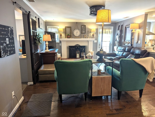 3236 Spruce St, Columbus, IN 47203 - living area with crown molding, hardwood / wood-style floors, a fireplace, and a barn door