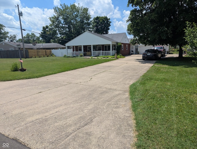 3236 Spruce St, Columbus, IN 47203 - ranch-style house with covered porch and driveway